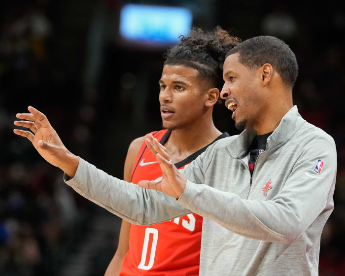 Former Rockets head coach Stephen Silas talks to guard Jalen Green at a NBA game against the Toronto Raptors at Scotiabank Arena.